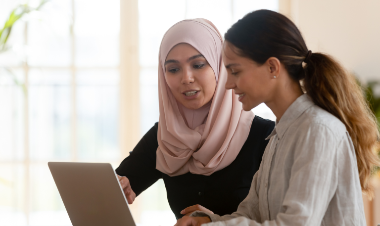 Two women at computer: Photo source - Canva